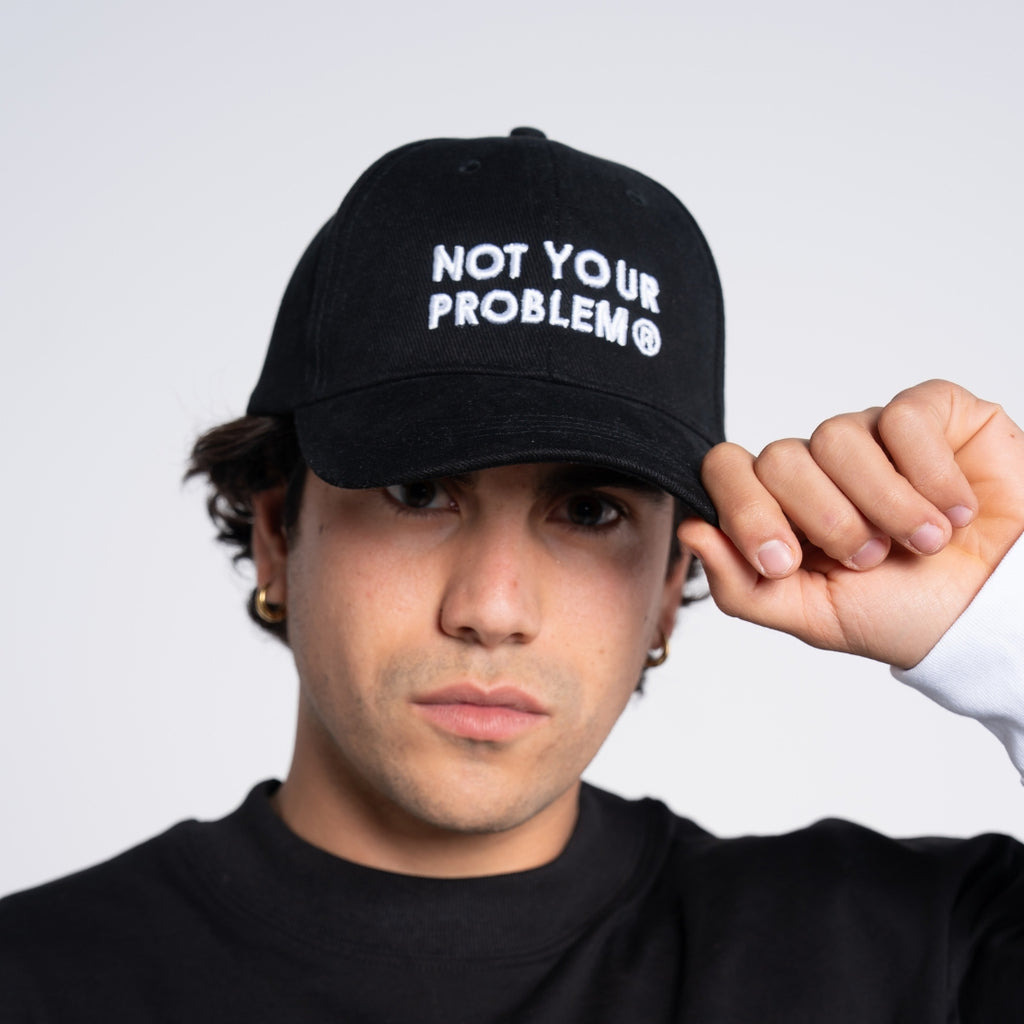 Not Your Problem® Cap – Black