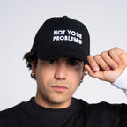 Not Your Problem® Cap – Black