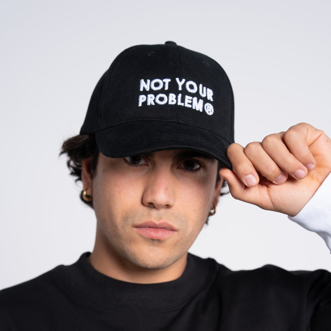 Not Your Problem® Cap – Black
