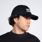Not Your Problem® Cap – Black