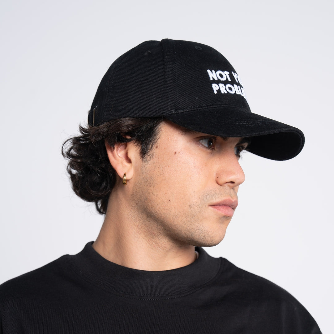 Not Your Problem® Cap – Black
