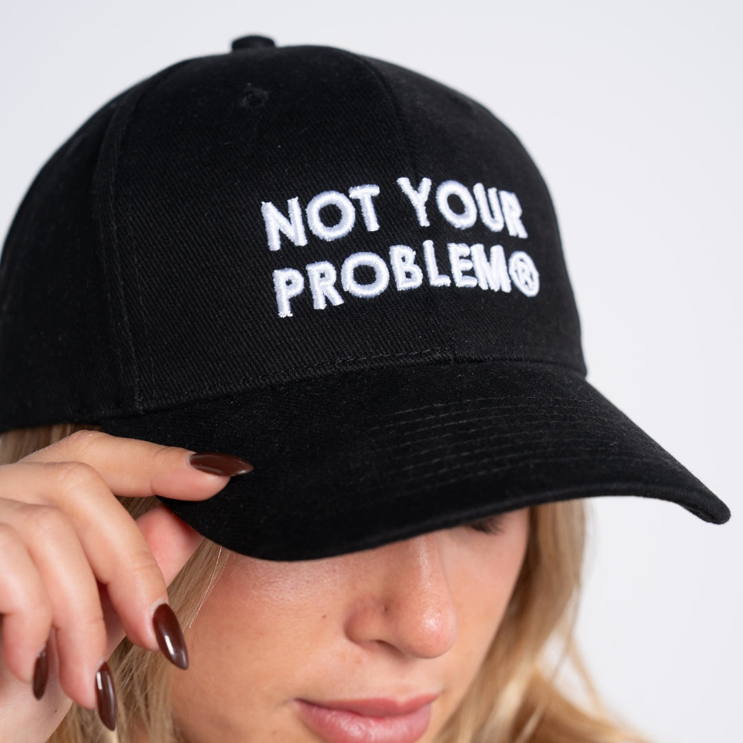 Not Your Problem® Cap – Black